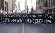 Protestors march through the streets of downtown Ottawa, Monday.